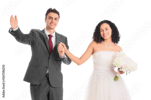 Young wedding couple holdin...
