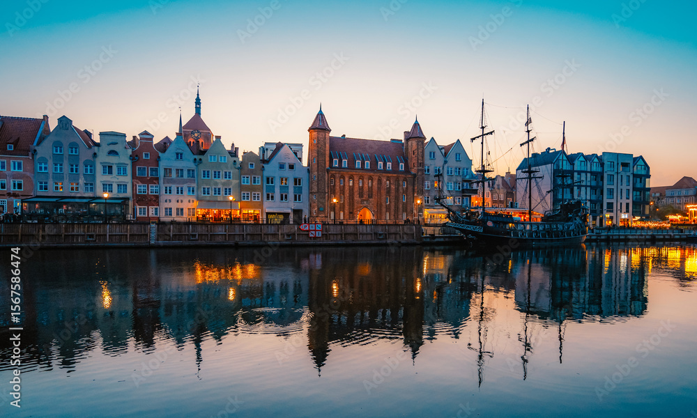 Fototapeta premium Gdansk with Motlawa river in Poland. Old town colourful house with Stragania Gate