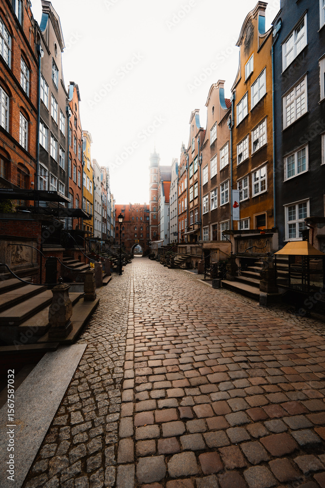 Fototapeta premium Gdansk with Motlawa river in Poland. Old town colourful house with church and Mariacka street