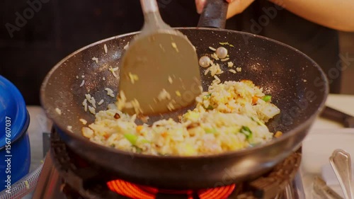 Fried Rice Stir Fry on Hot Stove � Asian Street Food Cooking Close-Up