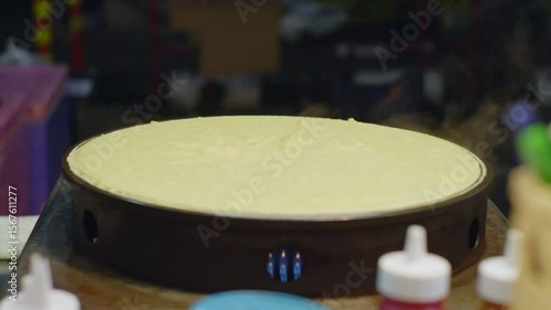 Street Crepe Batter Cooking on Hot Griddle � Night Market Scene