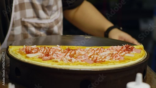 4k video of Street Food Crepe Okonomiyaki Prep with Crab Topping