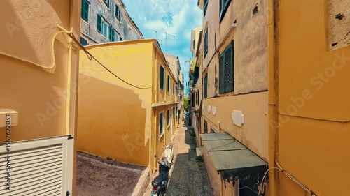Walking down the narrow street in Corfu island city, Greece