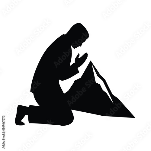 Black silhouette of person kneeling with head bowed in prayer near mountain