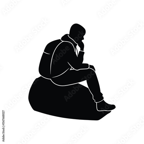 Black silhouette of person sitting on rock with hand on chin