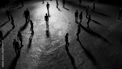 Photos Miniature figurines walking on a dark surface cast long shadows under a mysterio