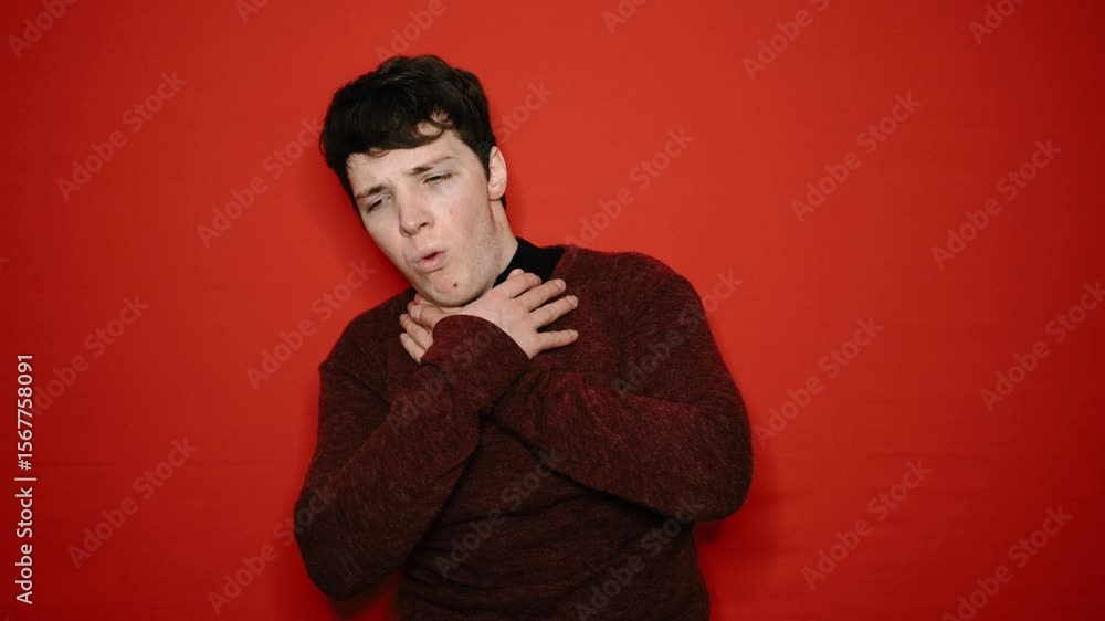Young attractive student and cold. Red background. Young attractive student and cold. Red background.