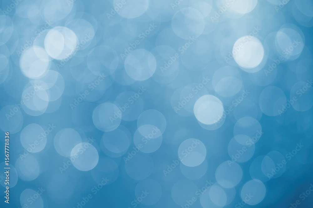 Fototapeta premium Soft blue and white bokeh lights with a blurred effect