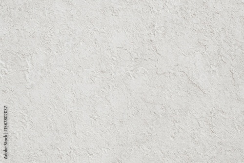 The exterior of a concrete structure features a textured white paint finish