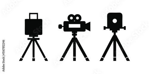 Three black film cameras on tripods video recording