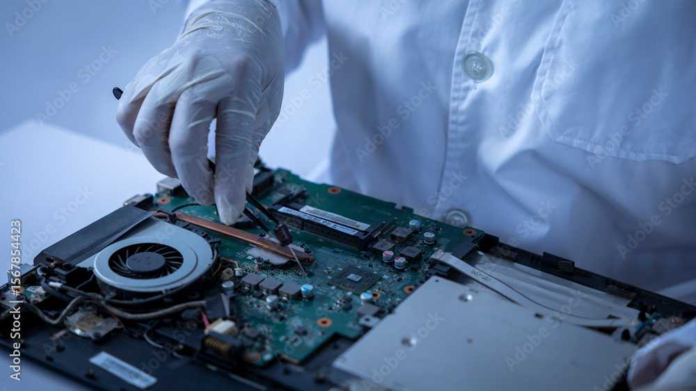 Naklejka premium Repairing a Laptop With Precision and Care