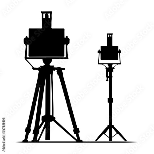 Black silhouette of two vintage large format cameras on tripods isolated