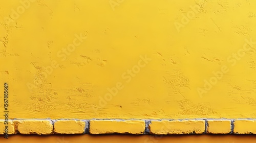 Golden Brick and Concrete Textured Wall: Close-up shot of a textured yellow wall, with a line of golden bricks at the base. Capturing simplicity and structure, evoking a sense of warmth and vibrancy.