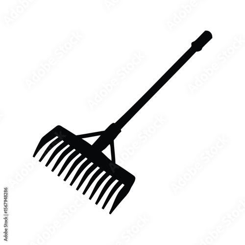Silhouette of a garden rake with handle used for lawn care