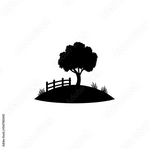 A black silhouette of a tree on a small hill, with a fence and grass tufts, against a plain white background, creating a minimalist nature scene.