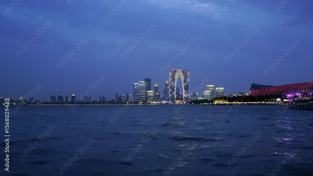 Experience the captivating beauty of Jinji Lake at night in Suzhou with stunning skyline views Experience the captivating beauty of Jinji Lake at night in Suzhou with stunning skyline views