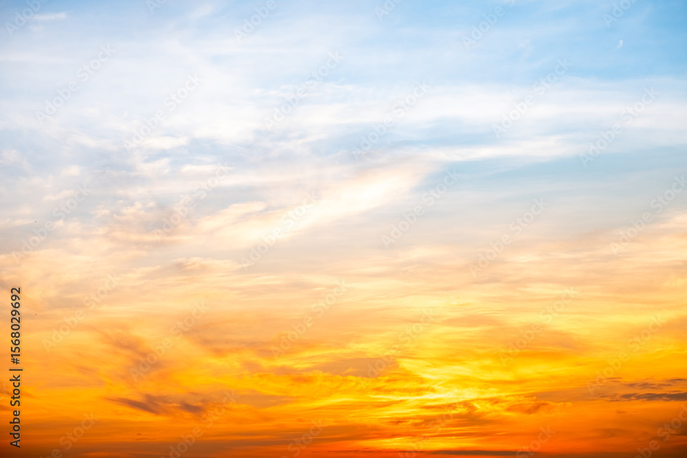 Fototapeta premium Beautiful , luxury soft gradient orange gold clouds and sunlight on the blue sky perfect for the background, take in evening,Twilight, Large size, high definition landscape photo