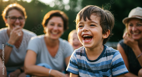 Joyful laughter fills the air as a child shares a lighthearted moment with family outdoors.