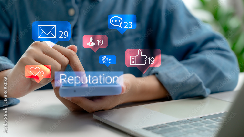 Fototapeta premium Person using smartphone with social media icons and Reputation hologram. Concept of online reputation management, customer feedback, and digital marketing strategy.