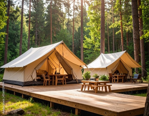 Cozy camping tents on a wooden deck in a forest