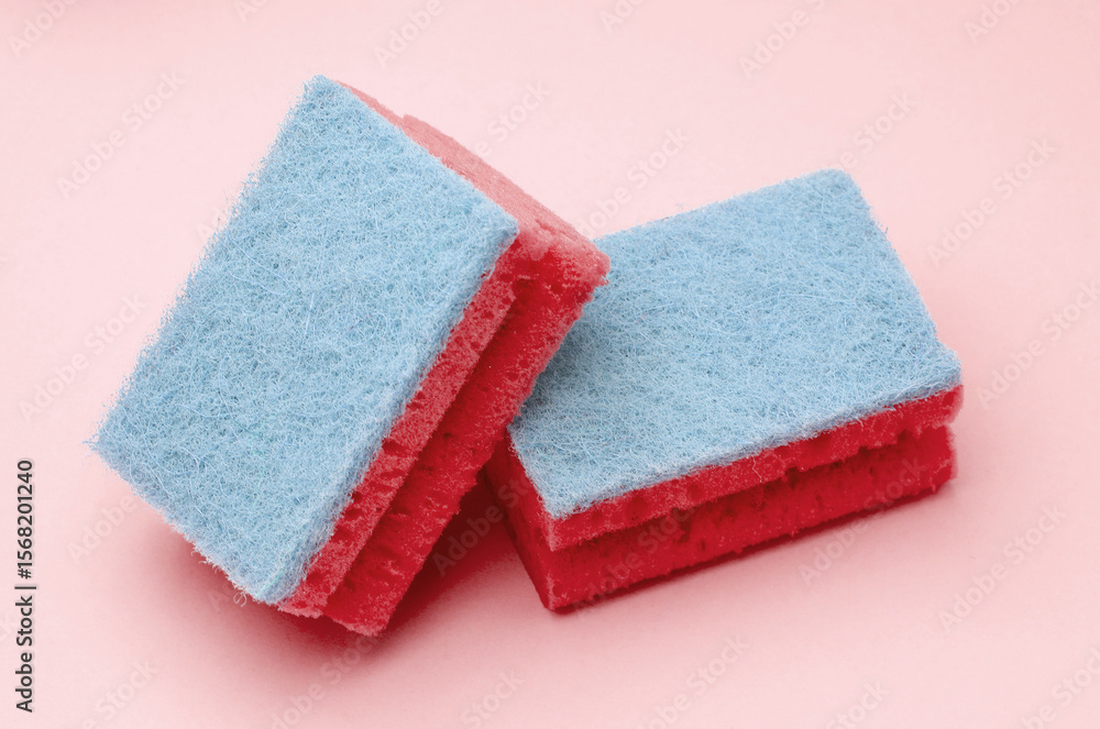Two cleaning sponges on pink background Two cleaning sponges on pink background