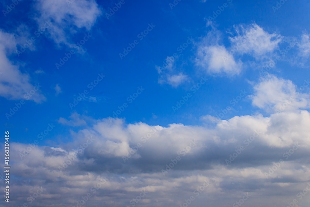 Fototapeta premium Beautiful Sky with Fluffy White Clouds, clear sky with natural lightning, blue color, summer background, cloud landscape.
