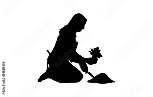 A woman kneeling in a flower garden planting a flower seedling vector