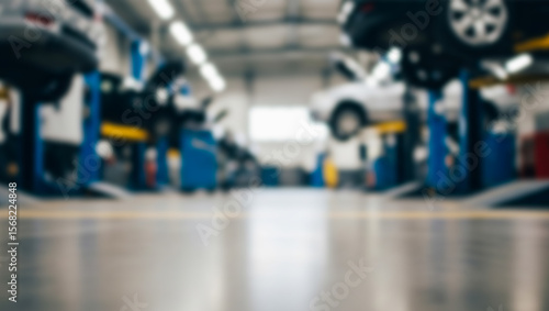 Wallpaper Mural Cars elevated on lifts in a garage or repair shop with blurred background. Torontodigital.ca