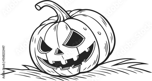 Spooky carved pumpkin on straw halloween jack o lantern