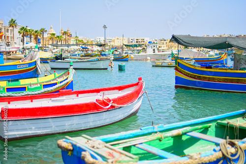 Wallpaper Mural Malta Republic, Malta Island. 25.05.2023. Marsaxlokk city, The harbour and brightly coloured traditional boats on a hot sunny day. Torontodigital.ca