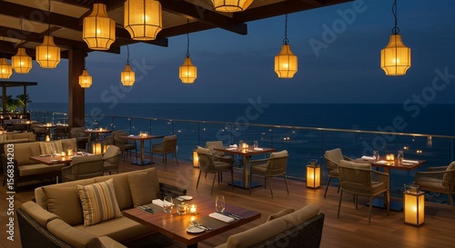 Elegant oceanfront restaurant terrace with lantern lighting at twilight