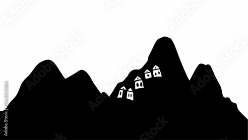 Silhouette of mountains with small houses clinging to the steep slopes in a monochrome landscape view