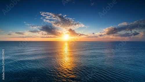 magnificence of sun descent upon vast expanse of sea horizon encapsulating a kaleidoscope of luminous hues serene waters and an ineffable bond between celestial and terrestrial realms