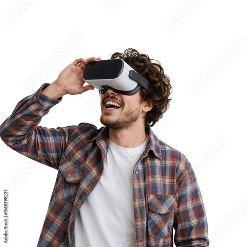 Young man with curly hair laughs while experiencing immersive virtual reality using VR headset with transparent background for versatile design projects.