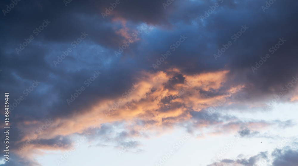 Fototapeta premium Beautiful bright sunset sky background with clouds. Evening time.