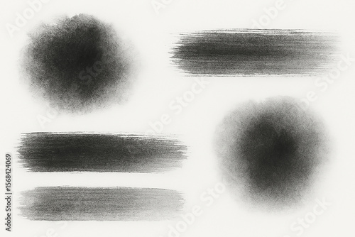 Black brush strokes and circular splatters paint