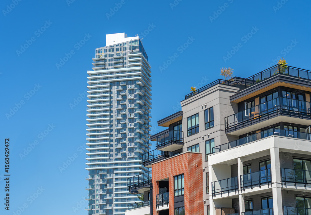 Fototapeta premium Top of modern apartment building with balcony, trees and beautiful landscape in Vancouver, Canada, North America. Day time on June 2025.