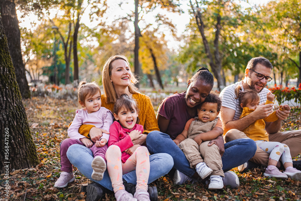 Fototapeta premium Autumn Embrace: A Tapestry of Family Love