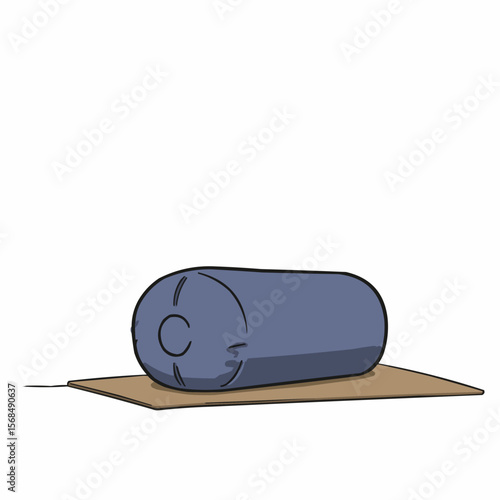 Yoga bolster resting on studio floor with natural light  