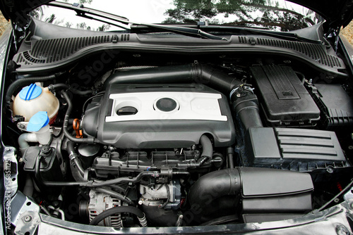 engine, open hood of a sports car. breakdown, repair. battery car engine detail motor. close-up of machine new engine checking car battery cleaning for, car service. auto motor