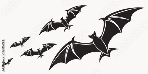 A flock of stylized black bats in flight against a plain white background isolated on white background