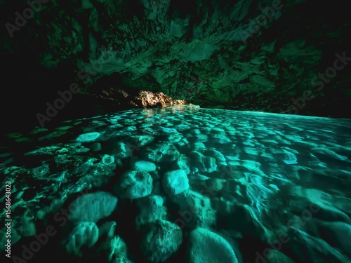 The Blue Cave in Albania is a mesmerizing natural wonder known for its vibrant azure waters and stunning rock formations.