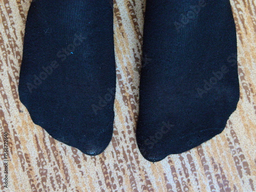 Men's feet in socks. Top view