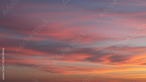 Vibrant Sky at Sunset with Pink Purple and Orange Clouds and Soft Light Illuminating The Horizon