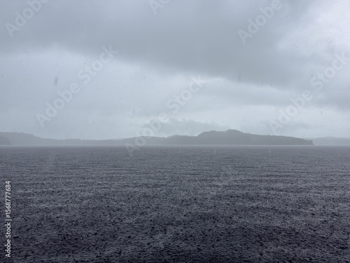 A west coast rains storm on a wild untouched lake.