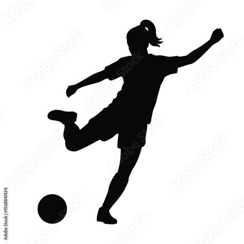 Silhouette of a female soccer player kicking a soccer ball
