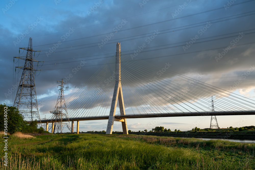Fototapeta premium view of the Flintshire Bridge, also known as the Second Dee Crossing, at sunrise