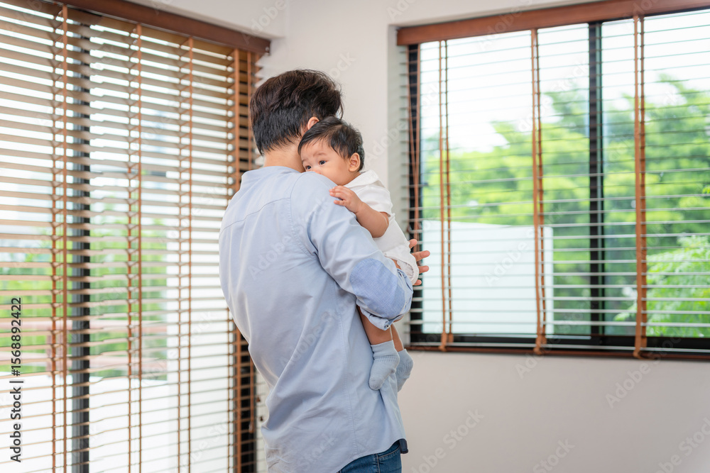 Asian Baby Sleeping Peacefully on Father's Shoulder, Father Cradling His Sleeping Infant, New Dad Soothing Baby at Home Asian Baby Sleeping Peacefully on Father's Shoulder, Father Cradling His Sleeping Infant, New Dad Soothing Baby at Home