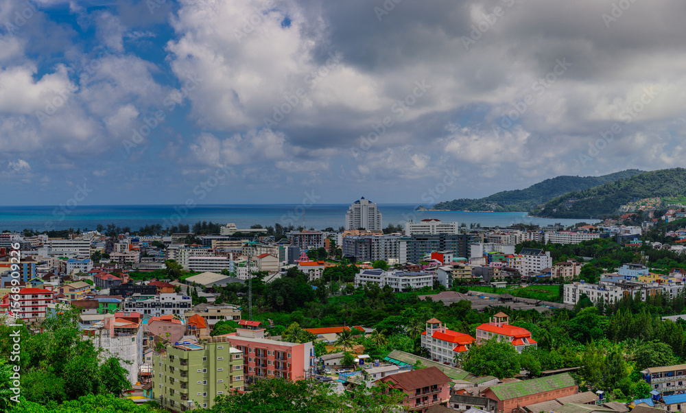 Fototapeta premium view of Patong and Patong Beach from the mountains colourful skies at Sunset. Patong is a vibrant city full of tourists from all around the world. 