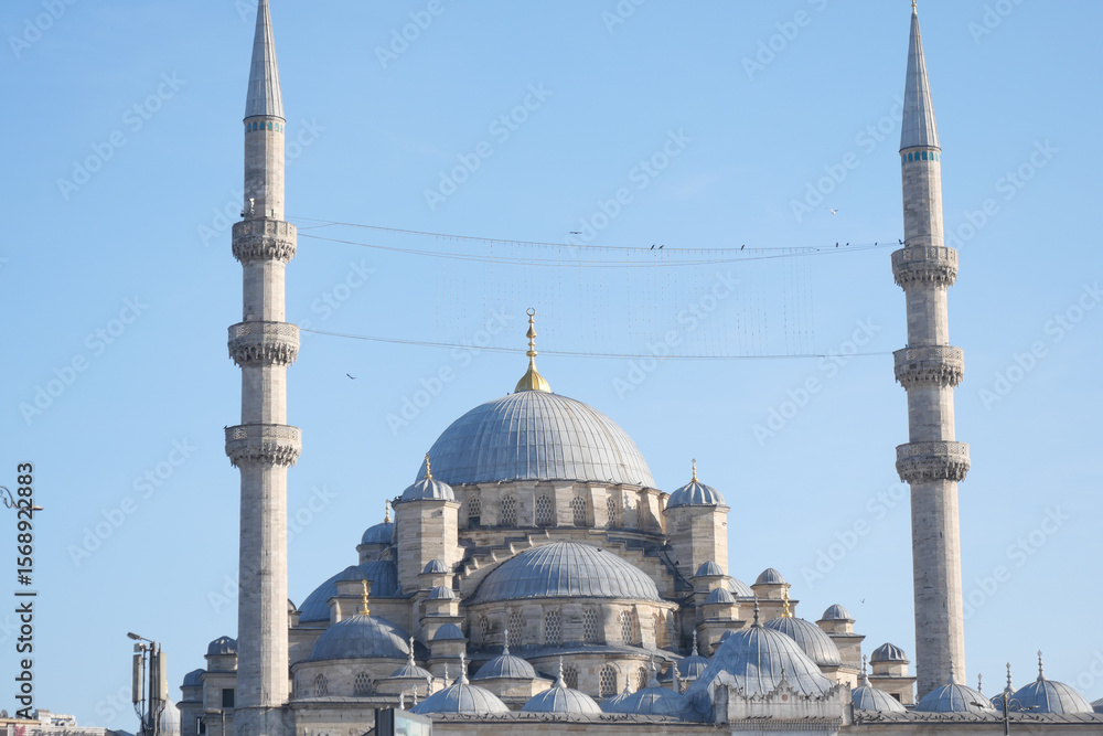 Fototapeta premium Beautiful mosque with minarets under clear blue sky